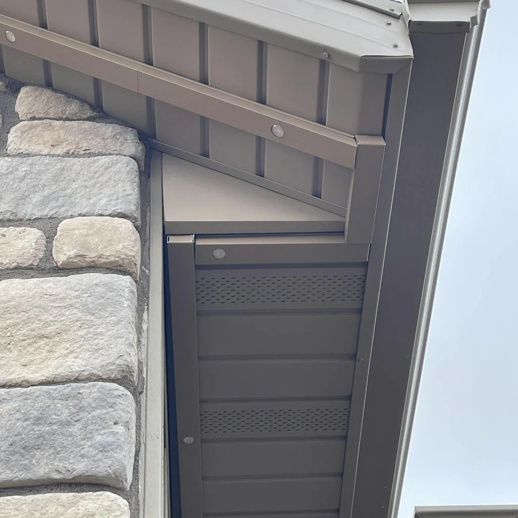 Close-up of daytime aluminum channel installed beneath a soffit